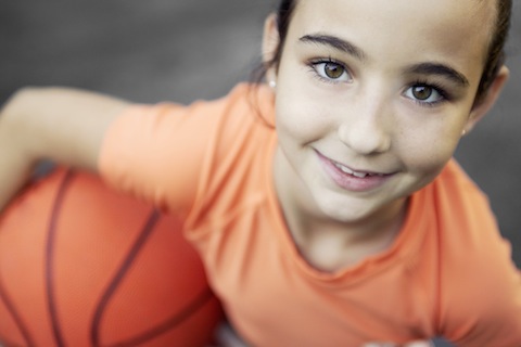 Little Girl Holding Basketball